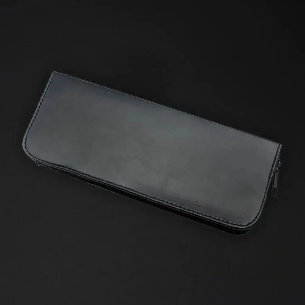 Black eco leather case for professional hair scissors, ideal for barbers and hairdressers, shown on a dark background.